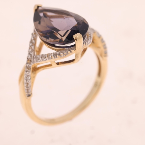 1521 - A 9ct gold tanzanite and cubic zirconia dress ring, maker R&C, set with pear-cut tanzanite and round... 