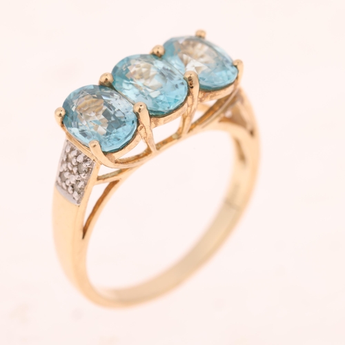 1523 - A 9ct gold blue topaz and diamond dress ring, set with oval mixed-cut topaz and single-cut diamonds,... 