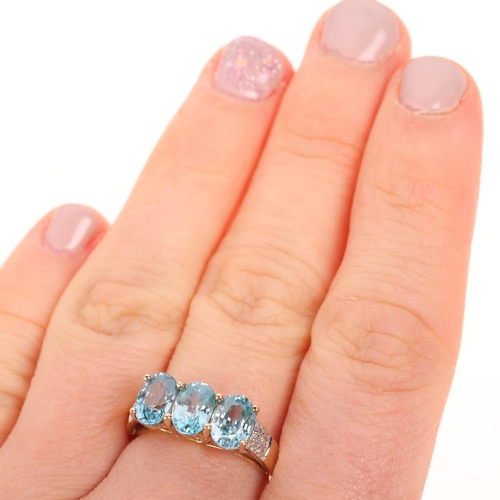 1523 - A 9ct gold blue topaz and diamond dress ring, set with oval mixed-cut topaz and single-cut diamonds,... 