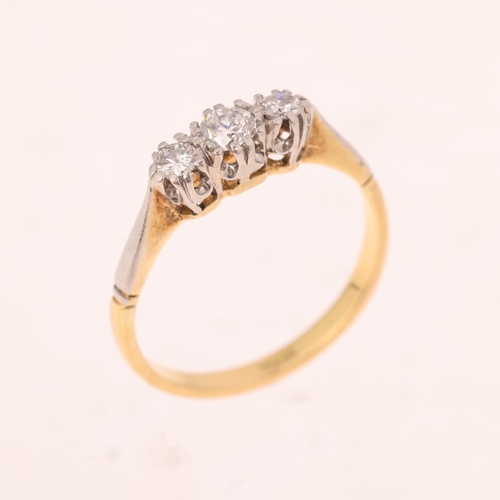 1527 - An 18ct gold three stone diamond ring, claw set with round brilliant-cut diamonds, total diamond con... 