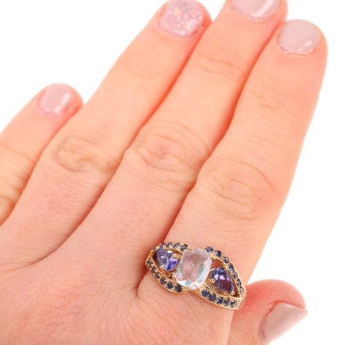 1532 - A 9ct gold opal tanzanite and sapphire dress ring maker TJC, set with oval mixed-cut opal with pear-... 