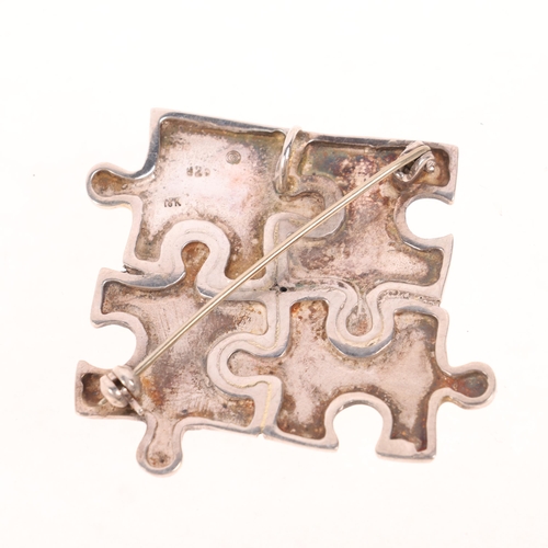 1566 - A LEODARAKIS - a Greek sterling silver and 18ct gold 'Puzzle' brooch/pendant, 47.6mm, 15.4g