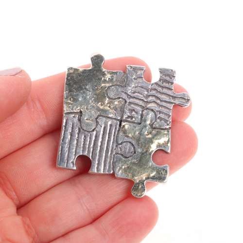 1566 - A LEODARAKIS - a Greek sterling silver and 18ct gold 'Puzzle' brooch/pendant, 47.6mm, 15.4g