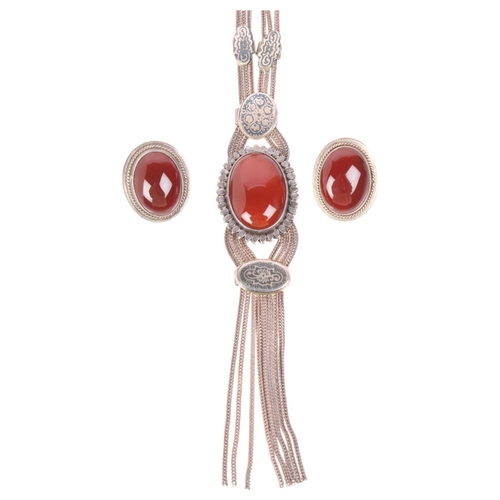 1577 - A Middle Eastern 900 silver niello and carnelian tassel necklace and pair of clip-on earrings set, p... 