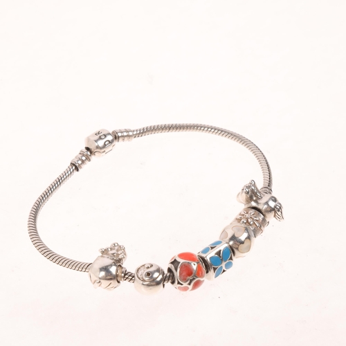 1578 - PANDORA - a sterling silver snake link charm bracelet, with 7 silver charms, 21cm, 40.7g