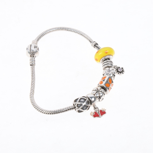 1579 - PANDORA - a sterling silver snake link charm bracelet, with 7 silver charms, 19.5cm, 33.6g