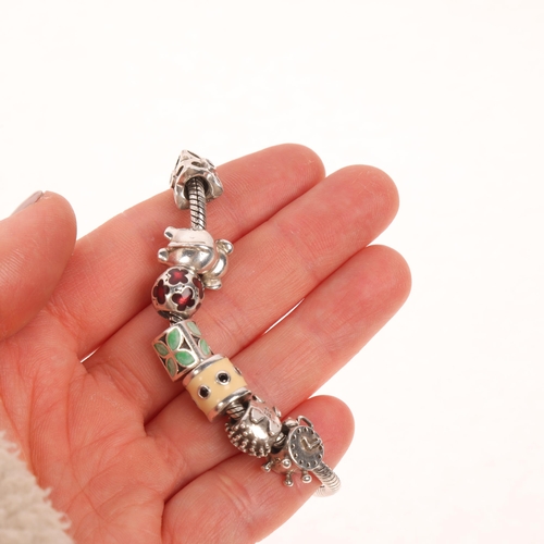 1580 - PANDORA - a sterling silver snake link charm bracelet, with 7 silver charms, 21cm, 40.8g