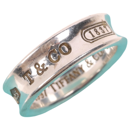 1582 - TIFFANY & CO - a sterling silver band ring, circa 1997, band width 7mm, size T, 8.6g