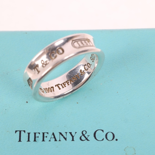 1582 - TIFFANY & CO - a sterling silver band ring, circa 1997, band width 7mm, size T, 8.6g