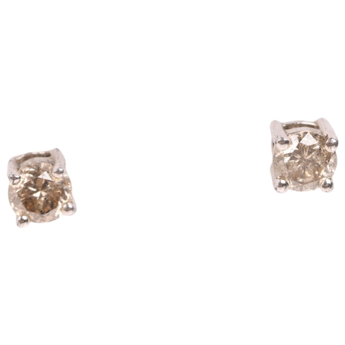 1586 - A pair of sterling silver 0.25ct single stone diamond stud earrings, each set with 0.12ct modern rou... 