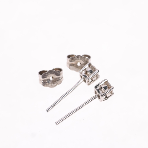 1586 - A pair of sterling silver 0.25ct single stone diamond stud earrings, each set with 0.12ct modern rou... 