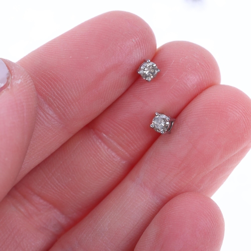 1586 - A pair of sterling silver 0.25ct single stone diamond stud earrings, each set with 0.12ct modern rou... 