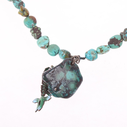 1589 - A single-strand graduated turquoise matrix bead necklace, with enamel articulated fish pendant, 36cm... 