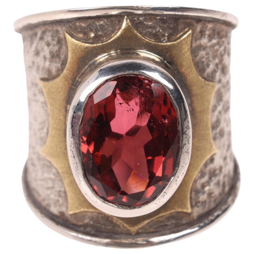 1591 - KIM POOR - a sterling silver and 18ct gold pink tourmaline band ring, rub-over set with oval mixed-c... 