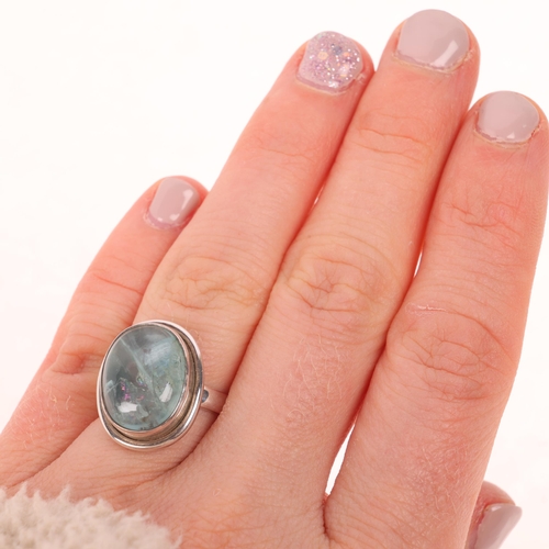 1601 - A sterling silver single stone aquamarine dress ring, setting height 18.6mm, size L, 5.9g