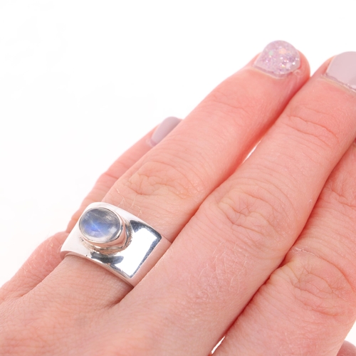 1604 - A modern sterling silver moonstone band ring, band width 11.4mm, size M, 14.2g