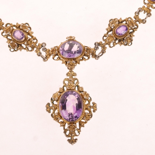 1606 - A Continental silver-gilt amethyst Renaissance Revival pendant necklace, each graduated panel set wi... 