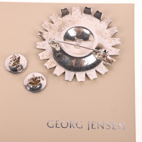 1610 - GEORG JENSEN - a Danish modernist sterling silver black enamel daisy pattern matching brooch and stu... 