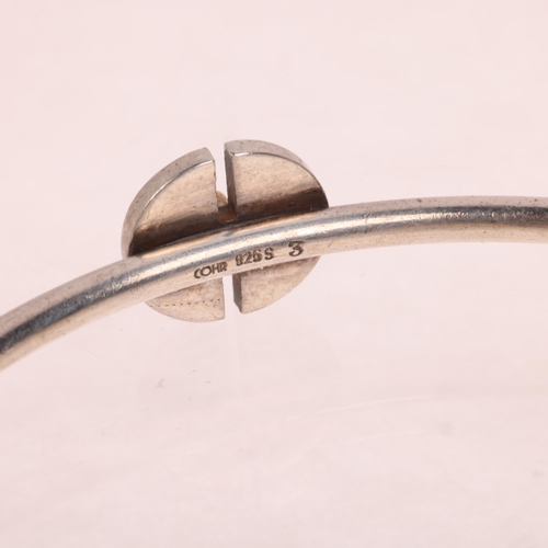 1619 - COHR - a Danish modernist sterling silver slave bangle, with halved circular mount and gilded peg, s... 