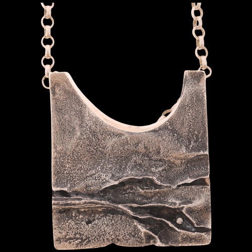 1622 - KNUD JORGENSEN RANDERS - a Danish brutalist oxidised sterling silver abstract pendant necklace, on s... 