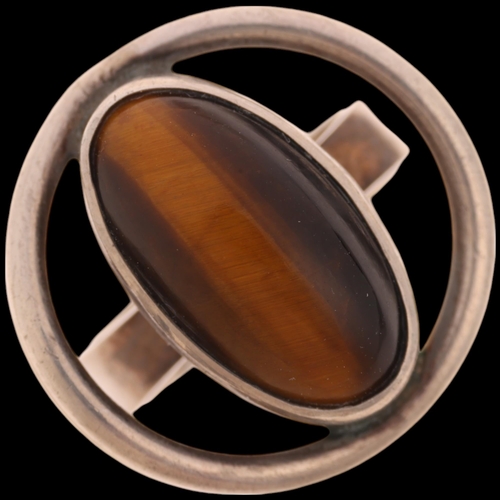 1624 - NIELS ERIK FROM - a Danish modernist sterling silver tigers eye 'Eye' ring, setting height 20.8mm, s... 