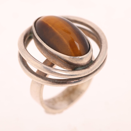 1624 - NIELS ERIK FROM - a Danish modernist sterling silver tigers eye 'Eye' ring, setting height 20.8mm, s... 