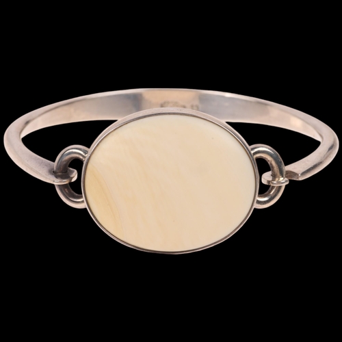 1644 - NIELS ERIK FROM - a Danish modernist sterling silver and marine ivory torque bangle, setting height ... 