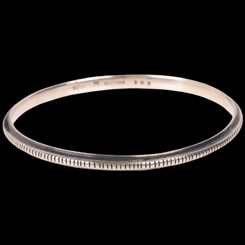 1660 - HANS HANSEN - a Danish modernist sterling silver slave bangle, model no. 209, band width 4.1mm, inte... 