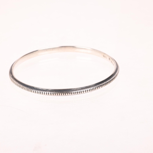 1660 - HANS HANSEN - a Danish modernist sterling silver slave bangle, model no. 209, band width 4.1mm, inte... 