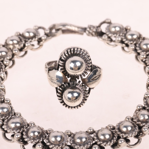 1677 - KURT C HERMANN DEHLI - a Danish modernist silver flowerhead ring and similar bracelet, ring size K, ... 