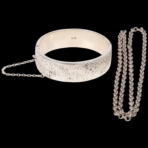 1690 - A silver hinged bangle, internal circumference 17cm, and a silver belcher link necklace, 50cm, 43g t... 