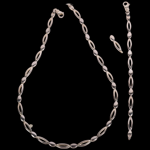 1693 - A sterling silver oval link chain necklace and bracelet set, necklace 42cm, bracelet 16cm, 44.2g tot... 