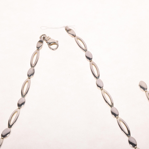 1693 - A sterling silver oval link chain necklace and bracelet set, necklace 42cm, bracelet 16cm, 44.2g tot... 