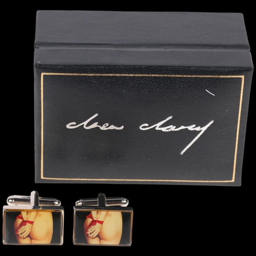 1695 - DREW DARCY - a pair of stainless steel 'Guilty Pleasures II' limited edition novelty cufflinks, 19.7... 