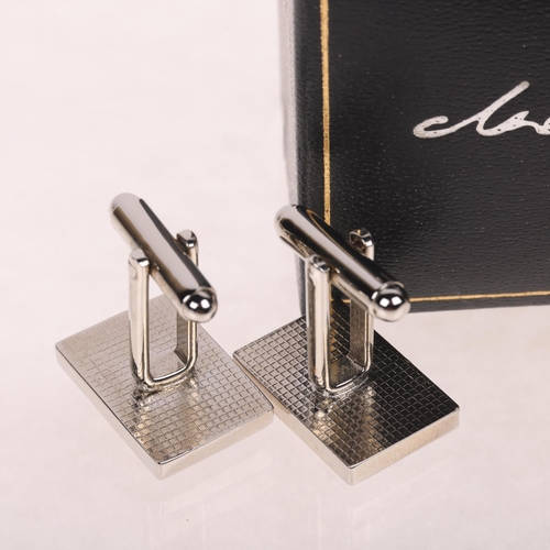 1695 - DREW DARCY - a pair of stainless steel 'Guilty Pleasures II' limited edition novelty cufflinks, 19.7... 