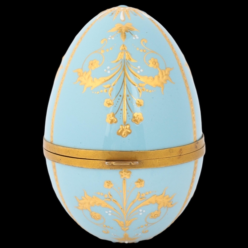 1750 - An Elizabeth II silver-gilt enamel egg box, maker WL, Birmingham 1985, the gilded duck egg blue enam... 