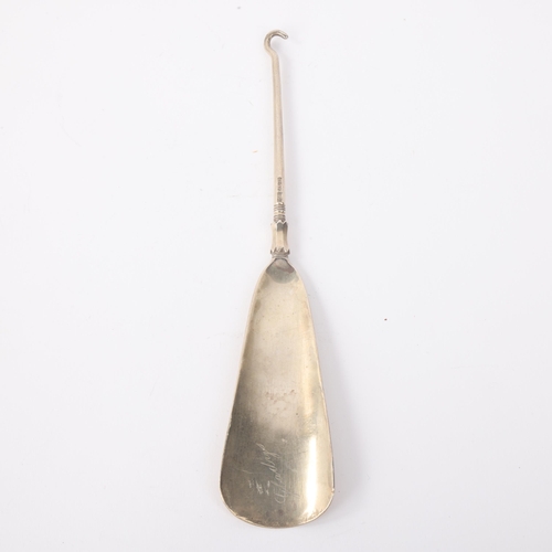 1777 - A Chinese export silver combination shoe horn/button hook, retailed by Luen Hing, circa 1910, with A... 