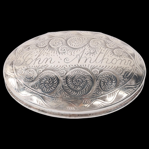 1797 - An Antique 18th century silver plated snuffbox, oval form with engraved spiral and star decoration, ... 