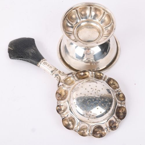 1807 - CARL M COHR - an Art Nouveau Danish silver tea strainer on stand, stylised form with ebonised handle... 