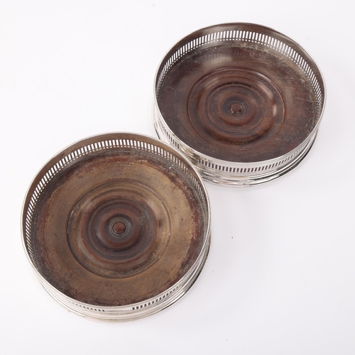 1809 - A pair of George III silver-mounted oak wine bottle coasters, Robert Hennell, London 1792, circular ... 