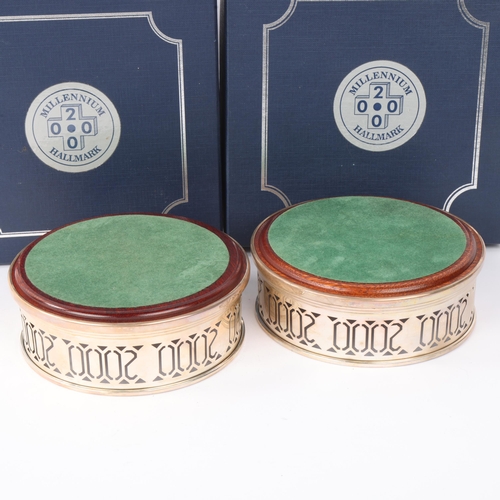 1810 - A pair of Elizabeth II silver-mounted oak 'Millennium' wine bottle coasters, WI Broadway & Co, Birmi... 