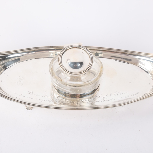 1815 - An Edwardian silver desk ink stand, William Hutton & Sons Ltd, London 1904, oval boat form with reed... 