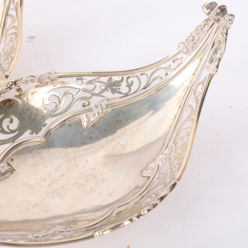 1819 - A pair of George V silver bon bon baskets, Mappin & Webb, London 1930, boat form with relief embosse... 