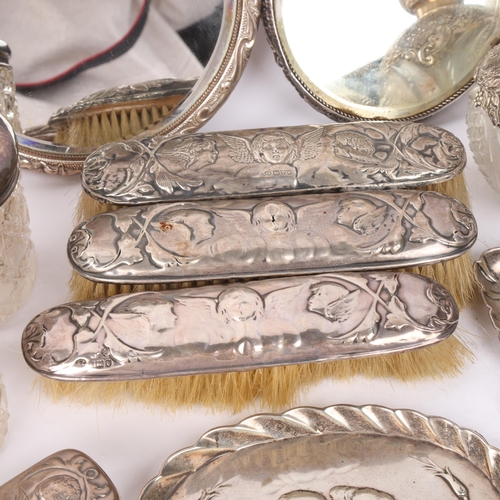 1832 - A quantity of Victorian and Edwardian silver 'Cherub' and 'Reynolds Angel's Heads' dressing table it... 