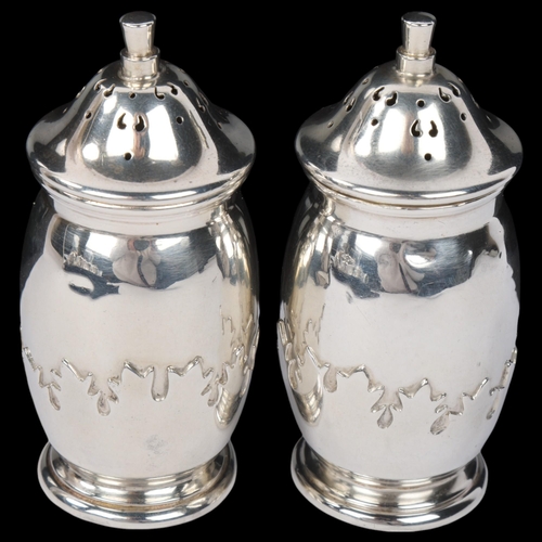 1837 - A pair of George V silver pepperettes, Roberts & Dore Ltd, Birmingham 1935, ovoid form with relief e... 