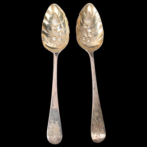 1877 - A pair of George III silver berry spoons, Stephen Adams, London 1805, relief embossed and gilded fru... 