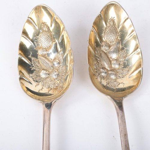 1877 - A pair of George III silver berry spoons, Stephen Adams, London 1805, relief embossed and gilded fru... 