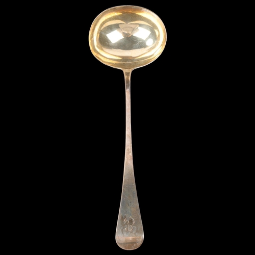 1879 - A George IV silver Old English pattern soup ladle, probably William Johnson, London 1823, gilded bow... 