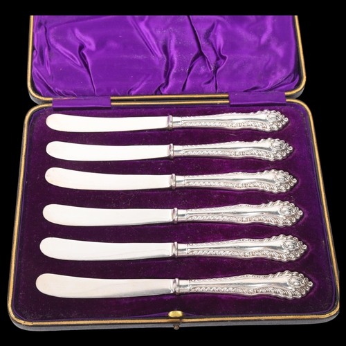 1886 - A cased set of 6 late Victorian silver-handled butter knives, James Deakin & Sons, Sheffield 1900, r... 