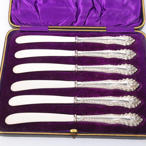 1886 - A cased set of 6 late Victorian silver-handled butter knives, James Deakin & Sons, Sheffield 1900, r... 